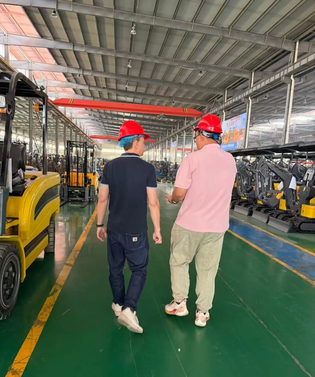Inside an audited factory: forklifts and mini excavators at the end of the line.