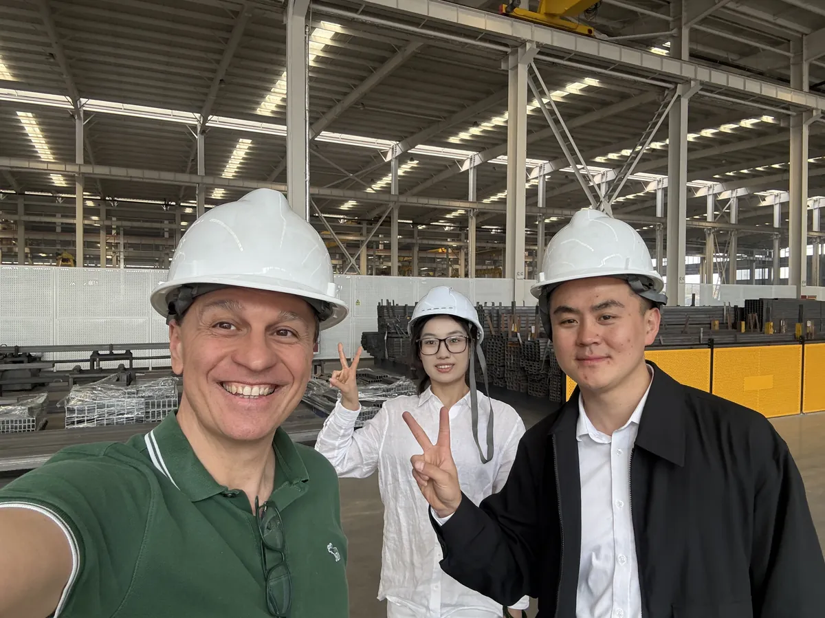 With a partner factory's team — the direct relationship behind the collective.